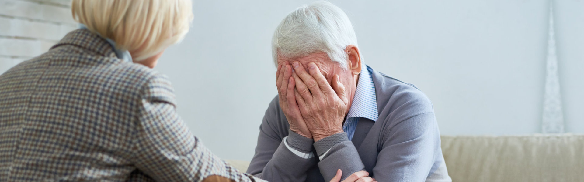 woman comforting senior